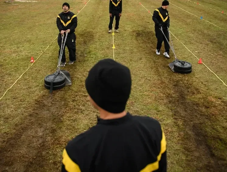  a soldier hauling a 90-pound sled under a blazing sun, heart racing, muscles screaming.